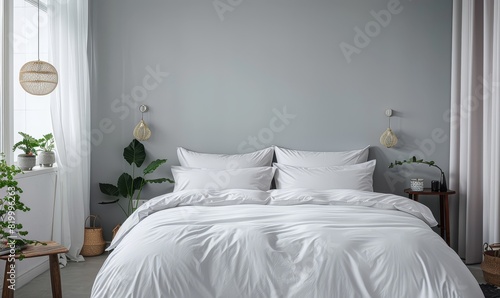 White duvet cover and two pillows on the bed. The duvet cover is made of 100% cotton percale and has a sateen weave. The pillows are made of 100% cotton sateen.