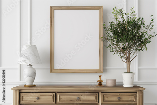 Square wooden frame mockup in traditional living room interior with classic chest of drawers marble lamp and small olive tree on white wall background. Illustration 3d rendering