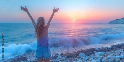 Embracing the Beauty of Nature: Woman on Rocky Beach at Sunrise with Arms Raised. Concept Nature, Woman, Rocky Beach, Sunrise, Arms Raised