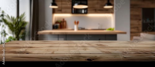A defocused image of a contemporary kitchen, showcasing the wooden countertop as the foreground