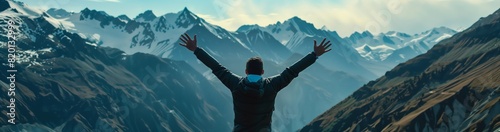 A man celebrates victory with a mountain view, expressing exhilaration and triumph near remote wilderness. Majestic peaks and picturesque scenery set the backdrop for this moment of success