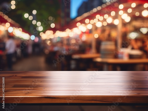 Amidst a night market blur, a wooden counter flaunts display products