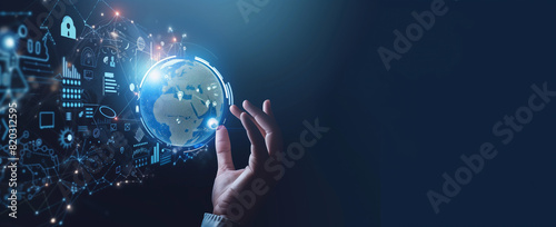  Digital technology concept, hand touching digital hologram of globe with icons and graphs on background, dark blue gradient background