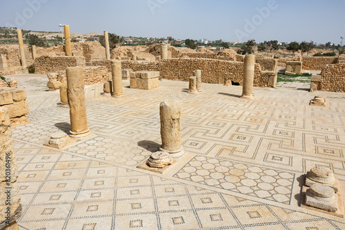 Remains of ancient Roman thermes bathing-place, built of light sandstone during Roman colonization era. Ancient city of Sufetula on African continent in modern Tunisia
