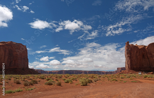 Monument Valley panorama, red desert landscape with navajo hut