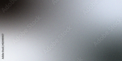 Abstract reflective shiny gray & white foil gradient blurred shine. Glowing Gray foil glitter metallic wall texture. Gray color gradient, ombre effect with rough, grain, noise, and bright spots