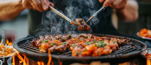 Professional enjoying a bite of Korean BBQ, hands and mouth in focus, showcasing the rich flavors and cultural authenticity