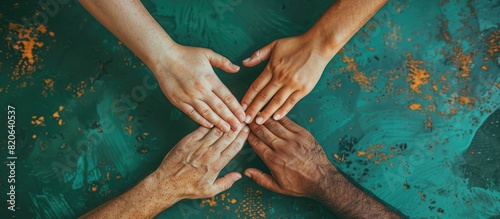 diverse hands coming together in unity, power and strength found through support for those living with aloneness concept