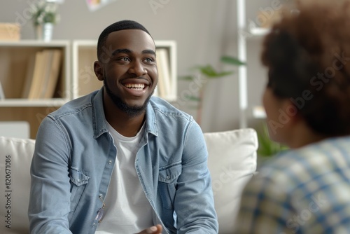 Unhappy young black man gay having session with professional psychologist at mental health clinic. Professional psychological help concept. Web banner