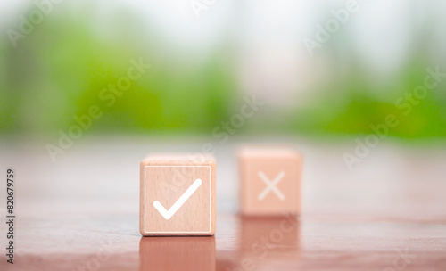 check right and wrong on the wood block. concept decide to choose vote. yes or no decisions, and business options for difficult situations in dilemma. Select the check mark sign 