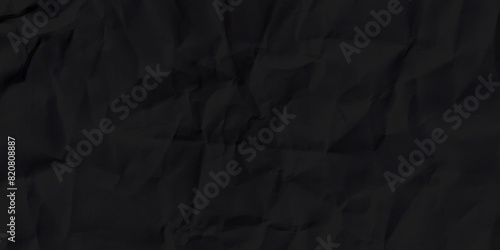 Black crumpled paper texture background. Crumpled black paper abstract shape background with space paper for text