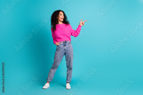 Full body portrait of nice young girl look direct finger empty space wear pullover isolated on turquoise color background