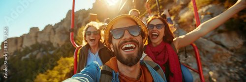 Energetic friends capture a group selfie against the backdrop of a sunlit mountain, radiating enthusiasm and the essence of outdoor exploration
