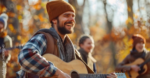 Joyful Guitar Player with Friends Enjoying Autumn Outdoors