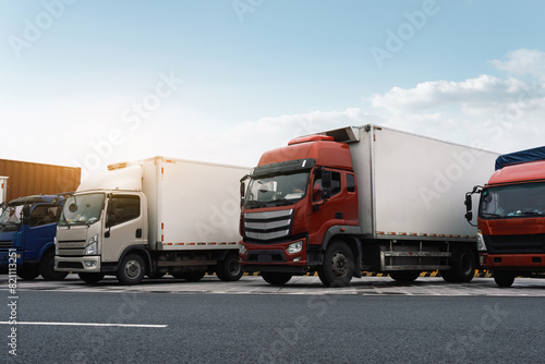 Commercial Fleet of Trucks Parked on Roadside