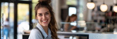 Radiant young female waitress smiling in a modern café with soft bokeh background, representing friendliness