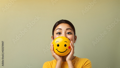 A winking smiley face with rosy cheeks on a yellow background.