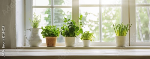 White wooden table in kitchen with green plant on the window, 