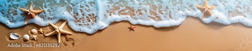 Banner of an aerial view of sea waves breaking against the sand of the beach, forming foam, starfish and shells of stranded crustaceans. Summer and vacation concept