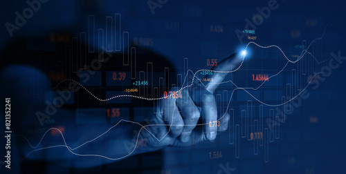 Trader analyzing data on virtual screen.Price graph and indicator. Stock market invest and crypto currency. Stock market and business investment.