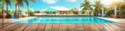 An idyllic summer scene is abstracted into a background where the gentle blur of a wooden deck and poolside leisure meld into one.