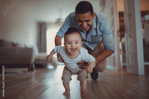 Young latinamerican father teaching his baby to walk, smiling, father's day concept