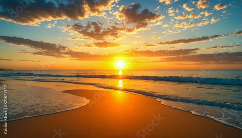 Breathtaking golden sunrise over a serene beach, with gentle waves lapping the sandy shores.