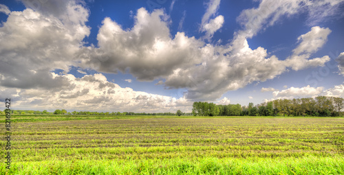 Great cloudscape floating over a rustic landscape in The Netherlands.