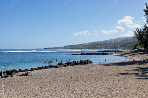 People enjoying the sun and the sea at the beach of Saint-Leu de la Reunion