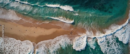 Scenic aerial view of a beach with blue ocean waves crashing on it. Beautiful seascape shot. Atmospheric sea coastal photography header wallpaper illustration concept.