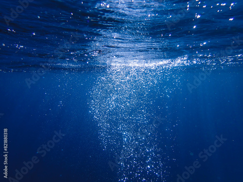 Air bubbles underwater rising to water surface, natural scene, bubbles under water, bubble undersea, sea in crystal clear green water. Real image very suitable for backgrounds, Great for background.