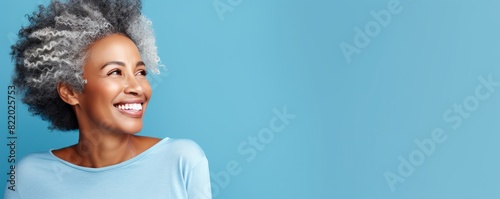 Blue background Happy Asian Woman Portrait of young beautiful Smiling Woman good mood Isolated on Background Skin Care Face Beauty Product Banner with copyspace 