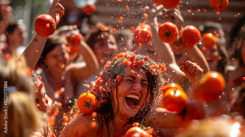 People enjoying La Tomatina festival with tomatoes thrown everywhere.