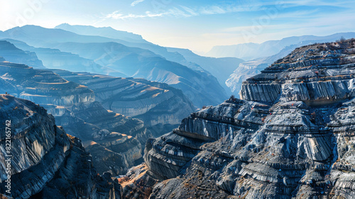 a panoramic view of fault-block mountains with layers of rocky terraces and ridges