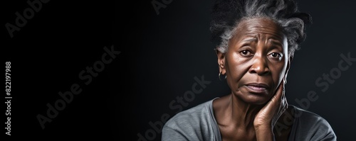 Charcoal background sad black American independent powerful Woman. Portrait of older mid-aged person beautiful bad mood expression girl Isolated on Background racism skin color depression anxiety fear