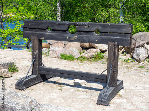 Closeup of a wooden pillory. Medieval pillory for public punishment and torture. The tool of torture for punishment in the Middle Ages