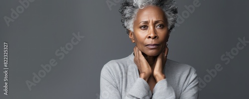 Silver background sad black American independent powerful Woman. Portrait of older mid-aged person beautiful bad mood expression girl Isolated on Background