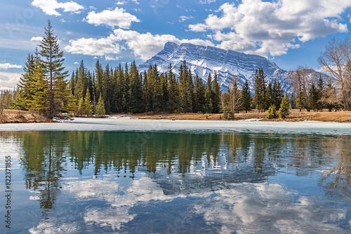 Daytime Spring Reflections On A Banff Mountain Lake