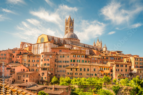 Siena, medieval town in Tuscany, with view of the Dome & Bell Tower of Siena Cathedral, Mangia Tower and Basilica of San Domenico, Italy