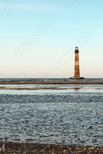 Morris Island Lighthouse from the shoreline of Folly Beach near Charleston, South Carolina.