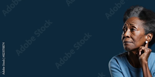 Blue background sad black american independant powerful Woman realistic person portrait of older mid aged person beautiful bad mood expression 