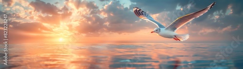 A seagull soars above the ocean at sunset. The sky is ablaze with color, and the water is calm and still. The seagull is a symbol of freedom and hope.