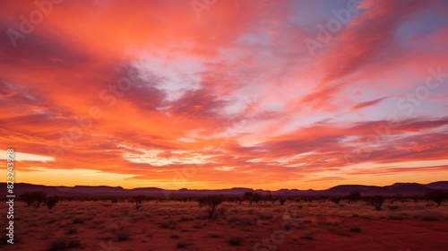 Sunset paints desert sky in shades of orange.