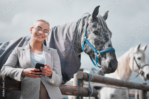 Portrait, phone and happy woman at horse farm outdoor with jockey in glasses for social media. Smile, mobile and person with equestrian animal at stable in countryside for training break in Texas