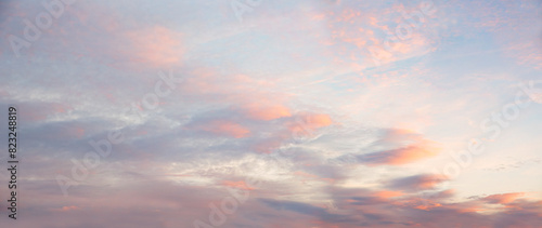 sunset sky panorama with soft light pink clouds
