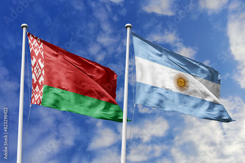 3d illustration. Belarus and Argentina Flag waving in sky. High detailed waving flag. 3D render. Waving in sky. Flags fluttered in the cloudy sky.