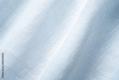 light blue fabric with a subtle texture showing intricate details and patterns