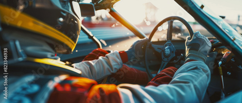 Racing driver in cockpit focuses on the track during a competitive race.