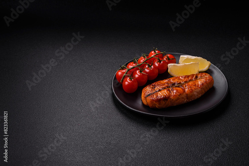 Fresh cooked delicious salmon steak with spices and herbs