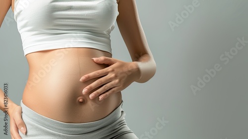 a studio shot of a closeup of A Fat, lose weight and woman touching stomach in studio with liposuction mockup